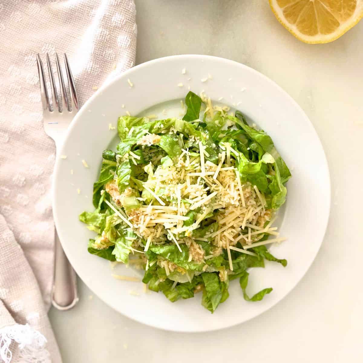 Caesar salad with homemade dressing and shredded parmesan