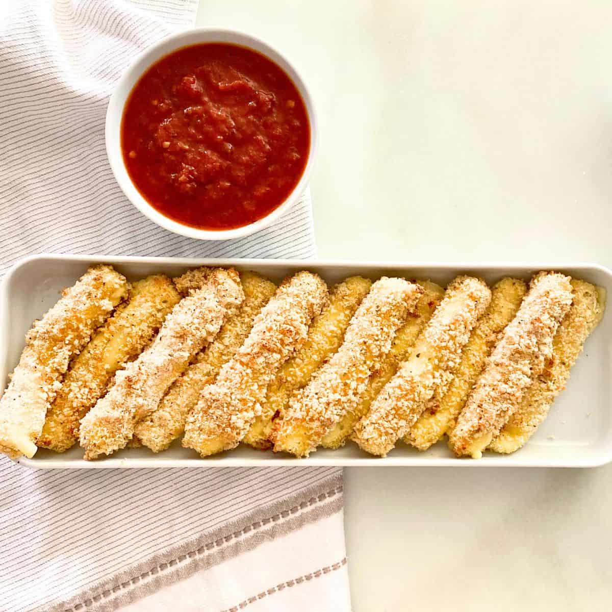 baked cheese sticks with sauce