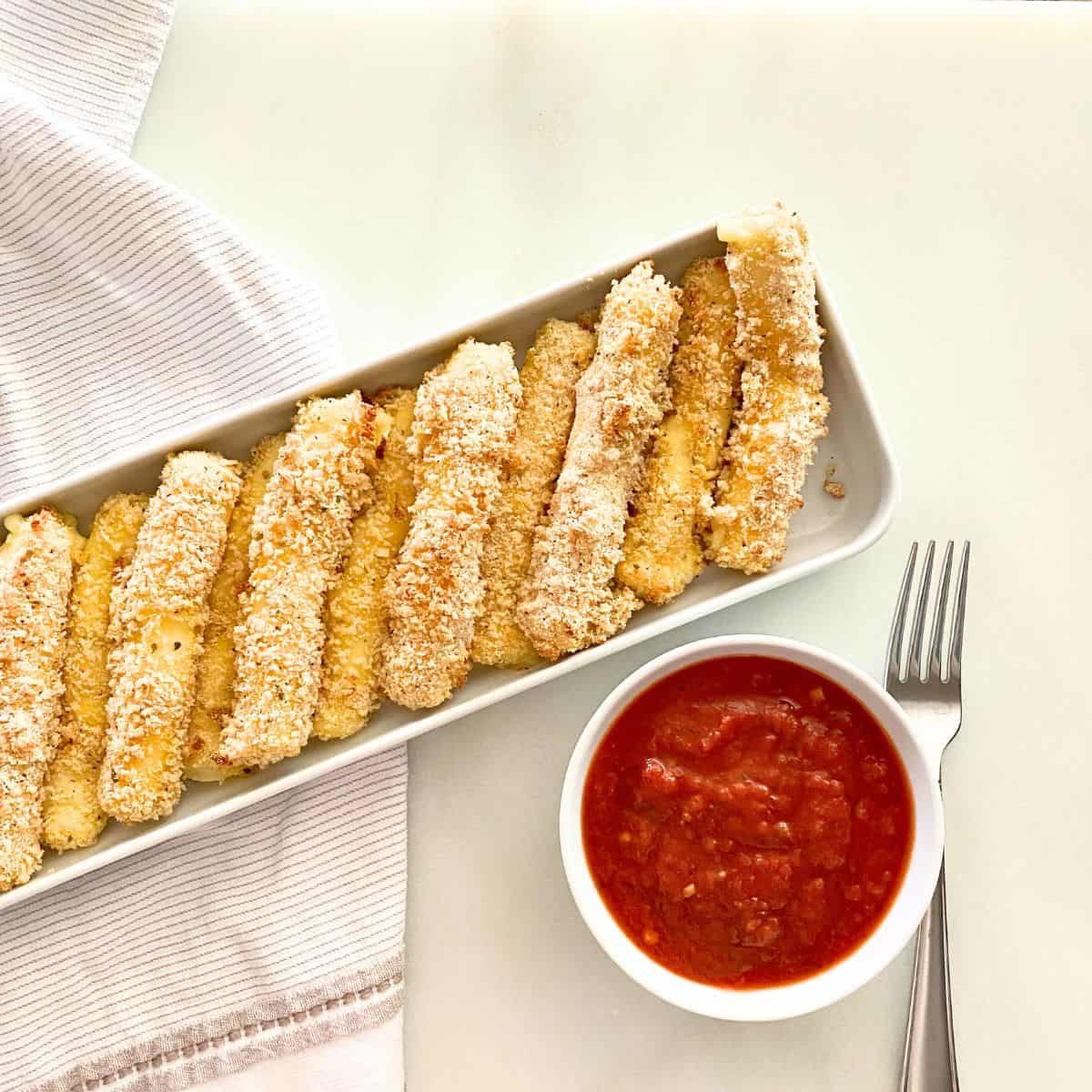 homemade cheese sticks with sauce