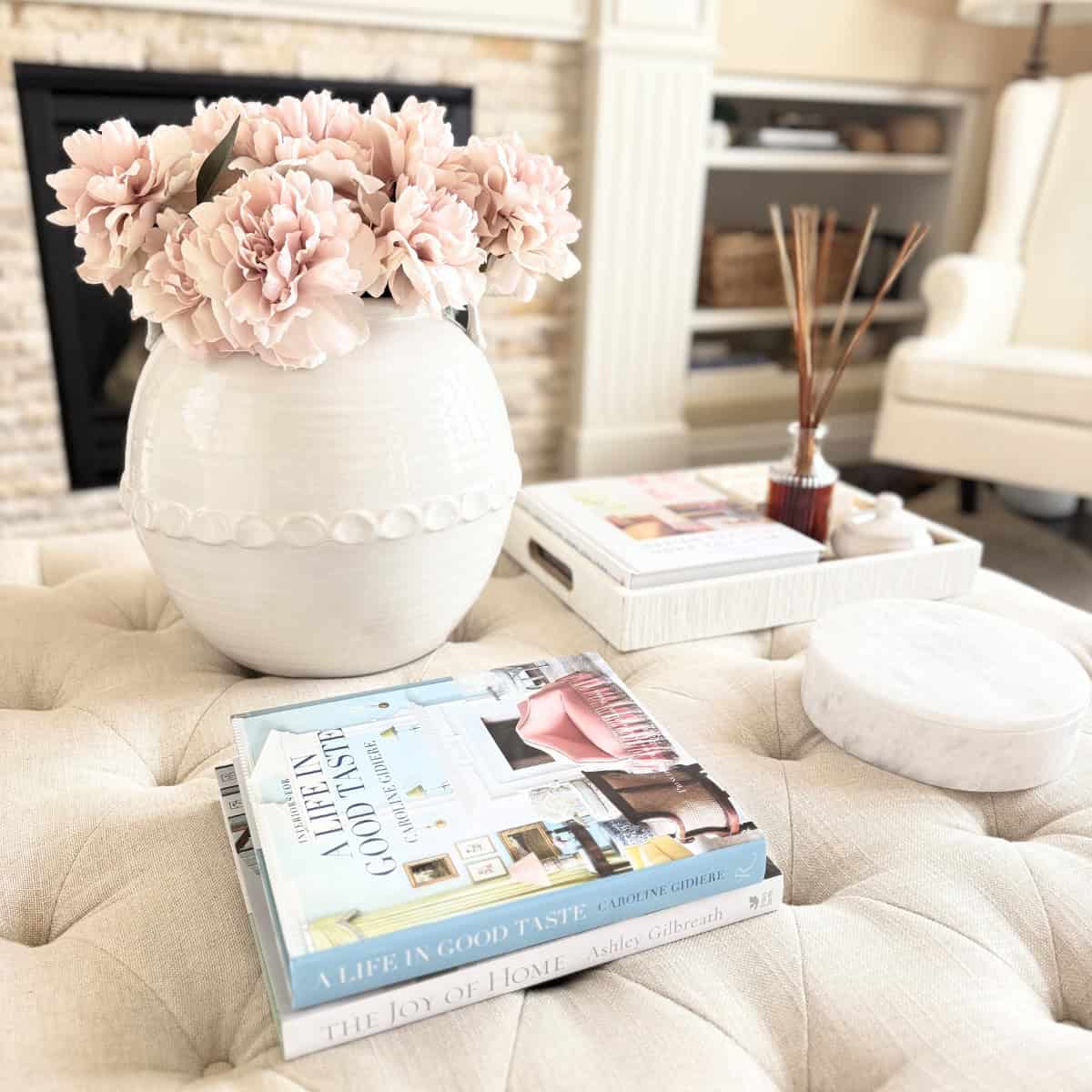 books and decor styled on an ottoman