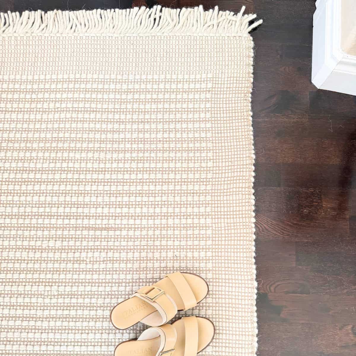 detail in an ivory entry rug