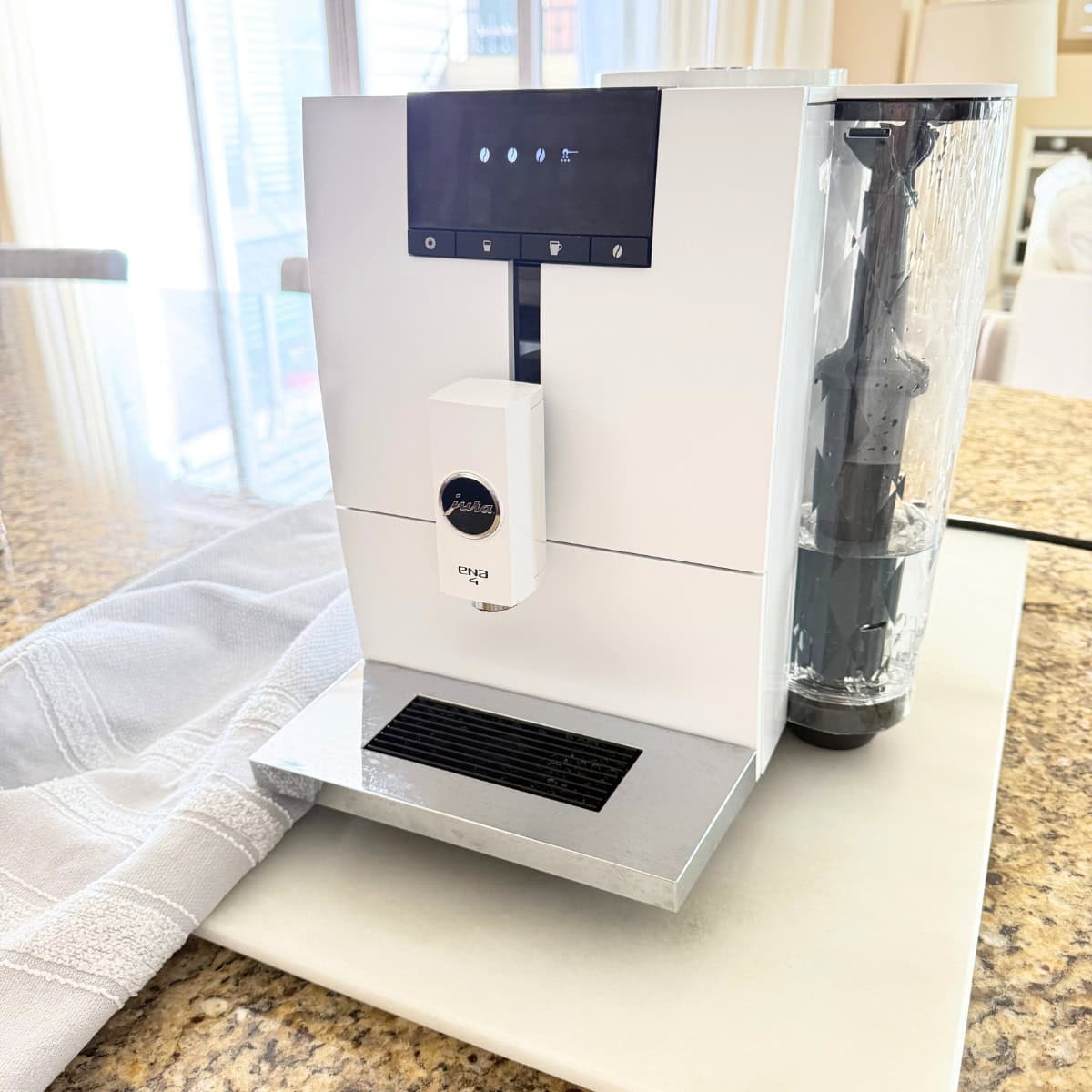 white jura coffee maker on kitchen counter