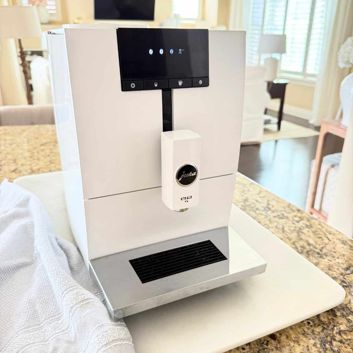white jura coffee maker on kitchen counter