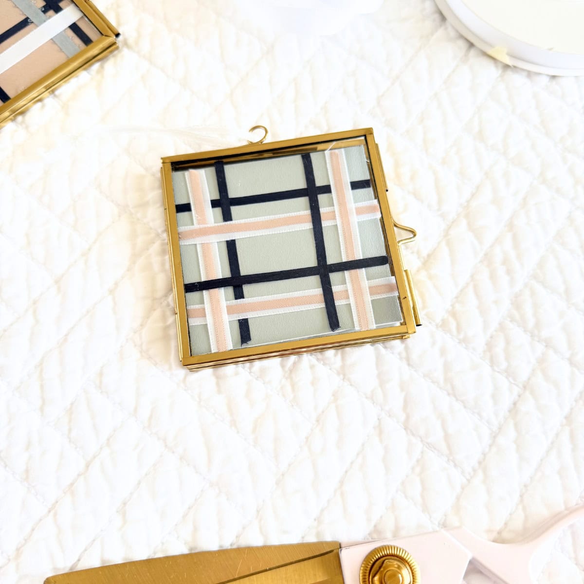 diy mini frame christmas ornament with plaid ribbon design and paint sheet background