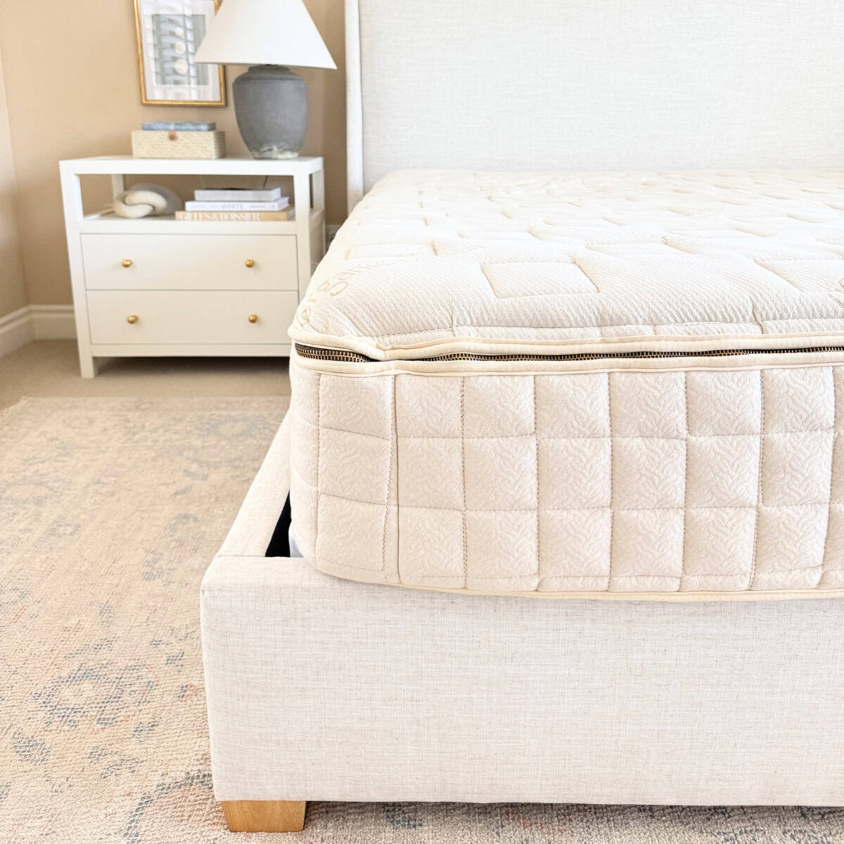 organic mattress on upholstered bed frame