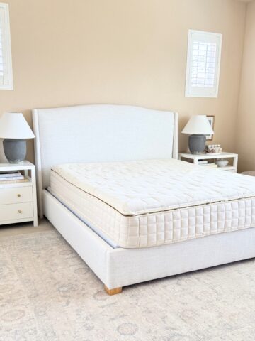 organic mattress on upholstered bed frame