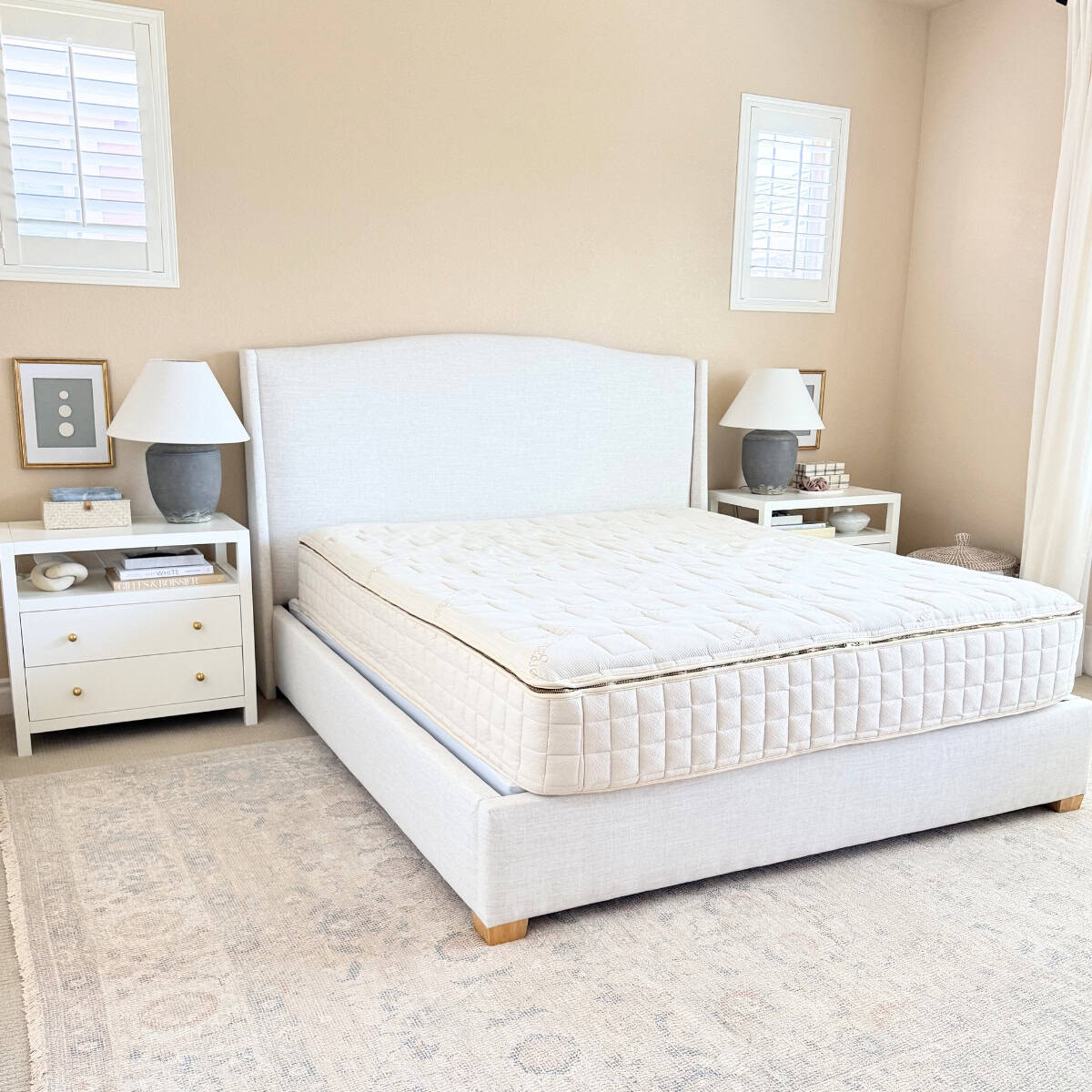 organic mattress on upholstered bed frame