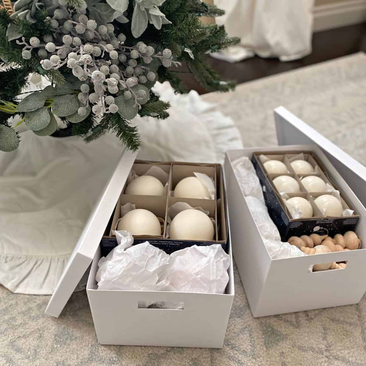 Christmas ornaments stored in white boxes