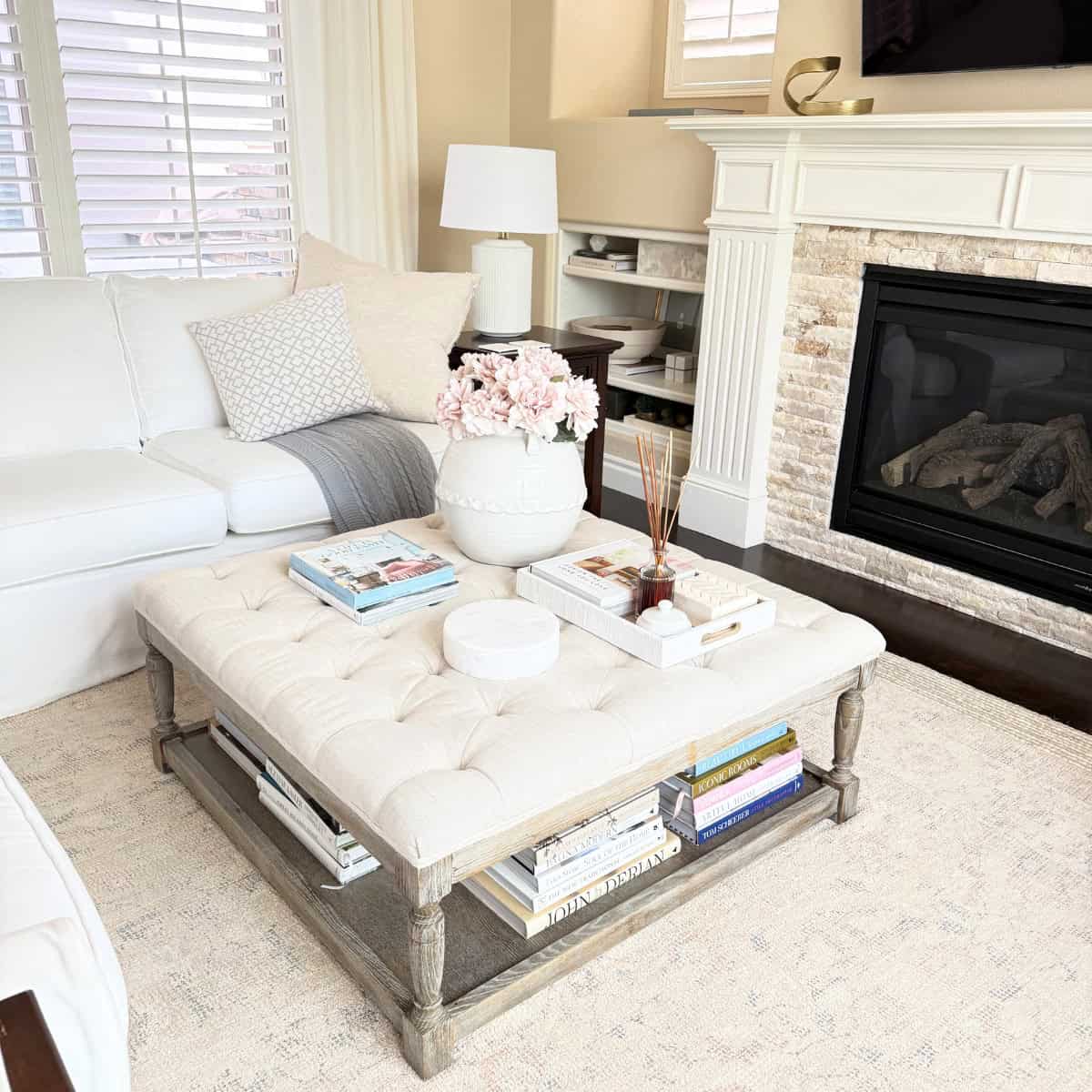 ottoman styled with books and decor
