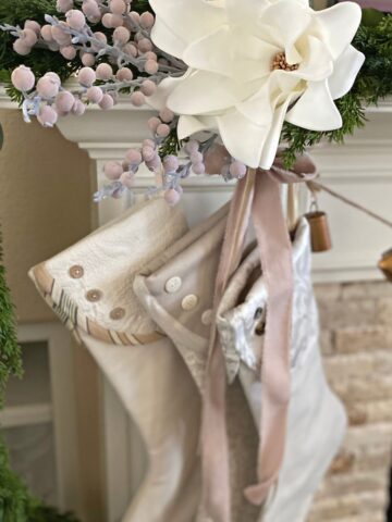 Neutral Christmas stockings, pink ribbon and soft pink decor
