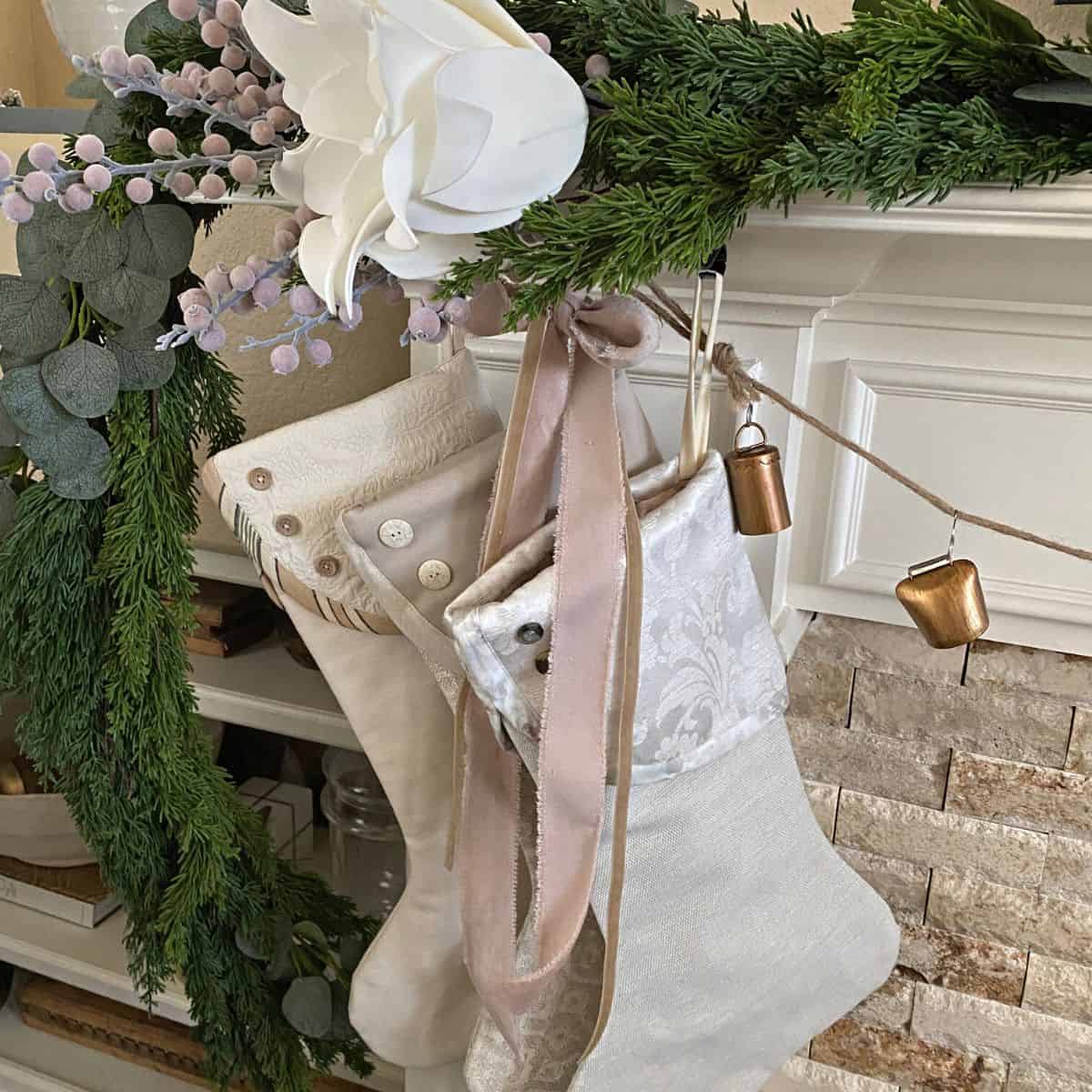 Neutral Christmas stockings, pink ribbon and soft pink decor