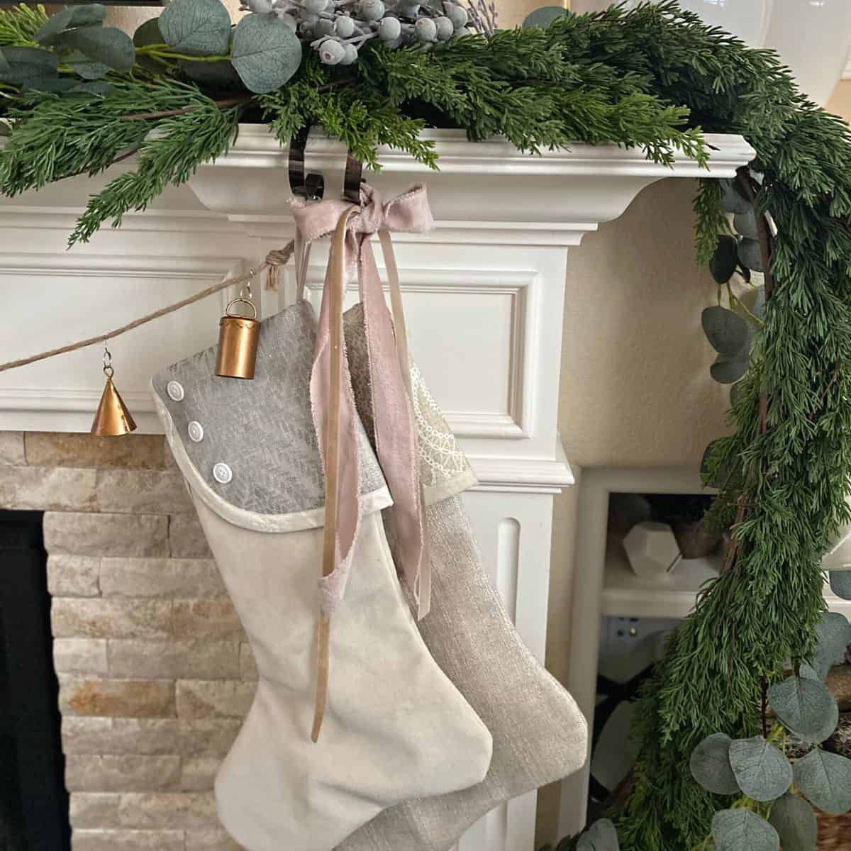 Neutral Christmas stockings, pink ribbon and soft pink decor