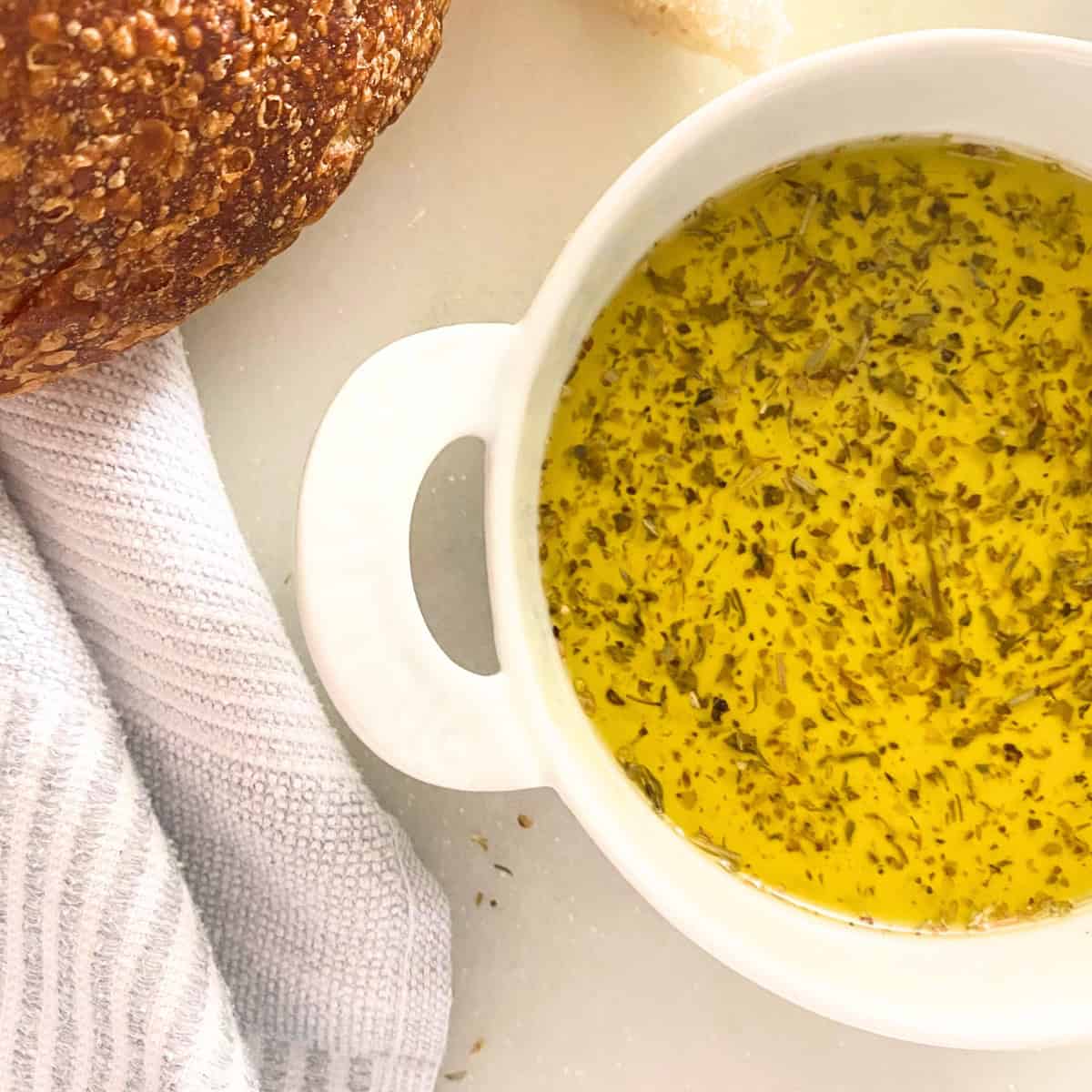 olive oil dip in white porcelain créme brûlée dish