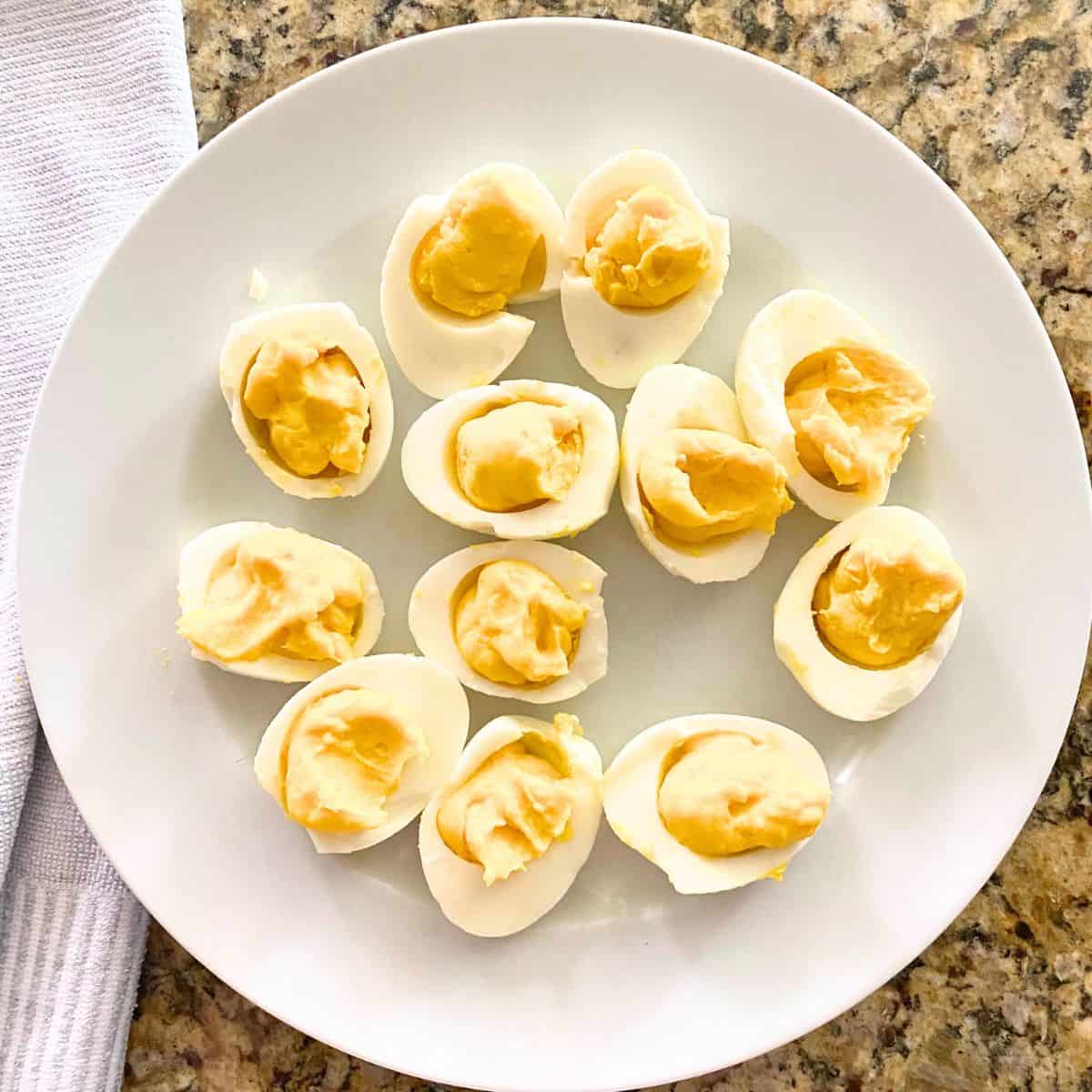 Plain deviled eggs on a white plate