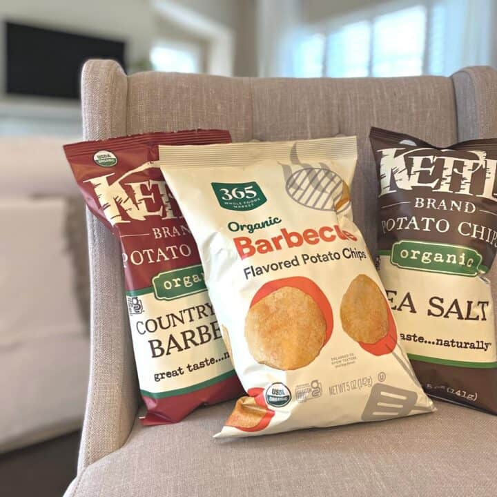 Assortment of potato chips styled on a linen counterheight chair