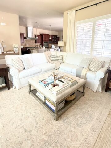 living room with white slipcovered sofa
