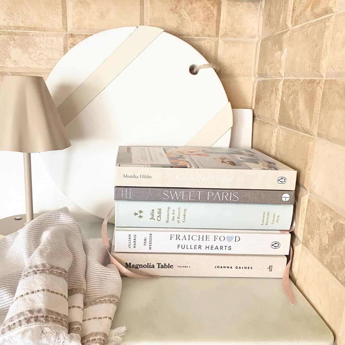 stacked cookbooks styled in kitchen