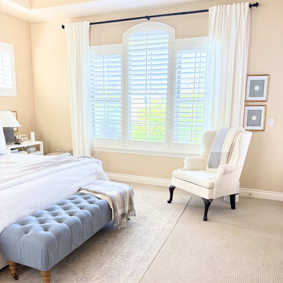 bedroom styled with a wingback chair