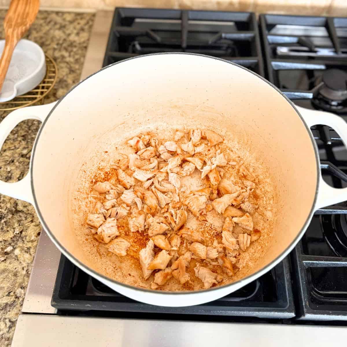cooked chicken in a dutch oven pot