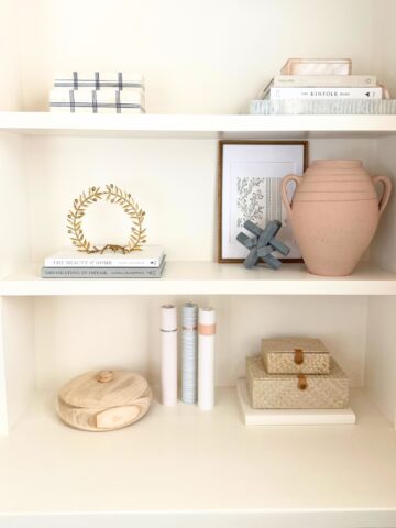 built-in shelves styled with various decor