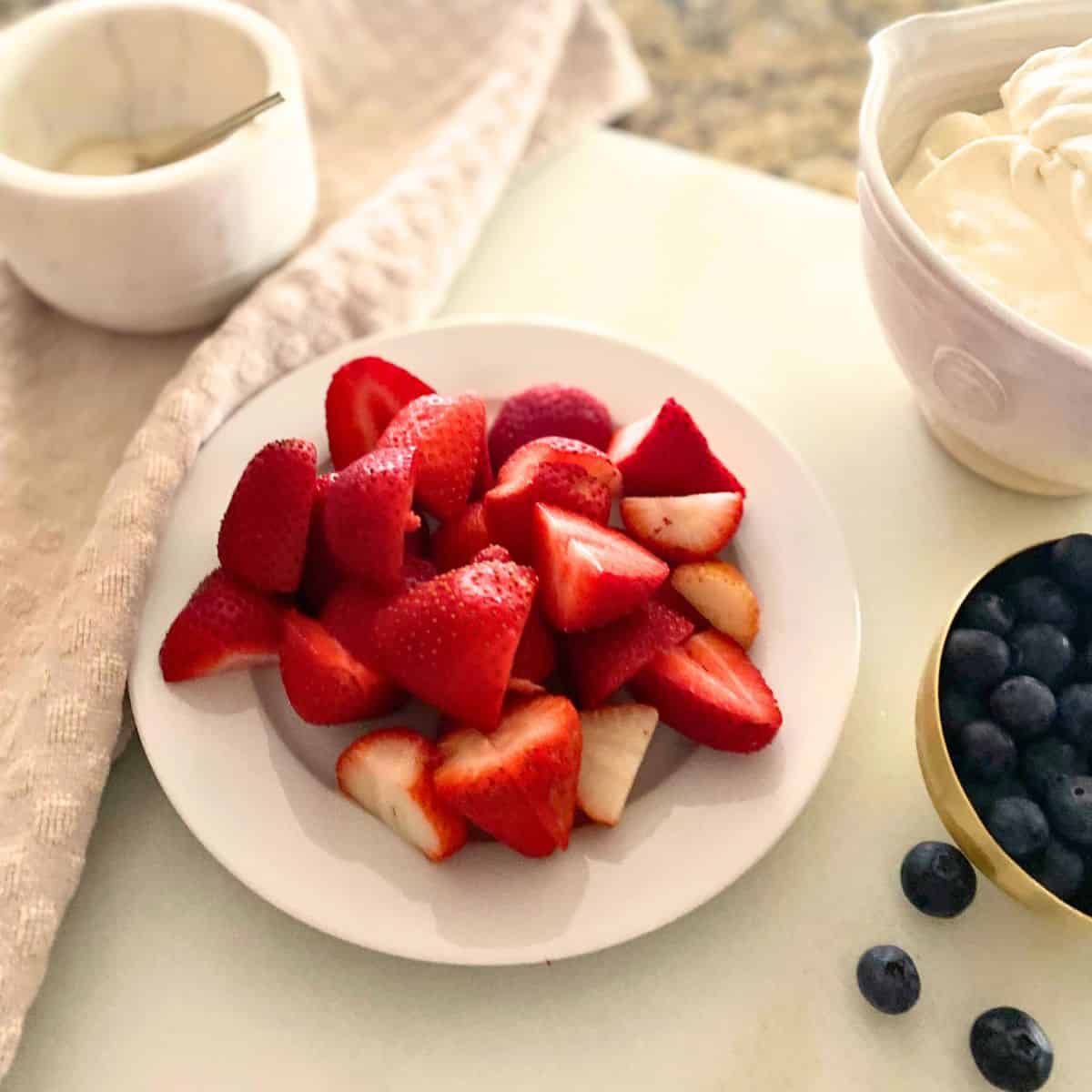 sliced strawberries on a plate