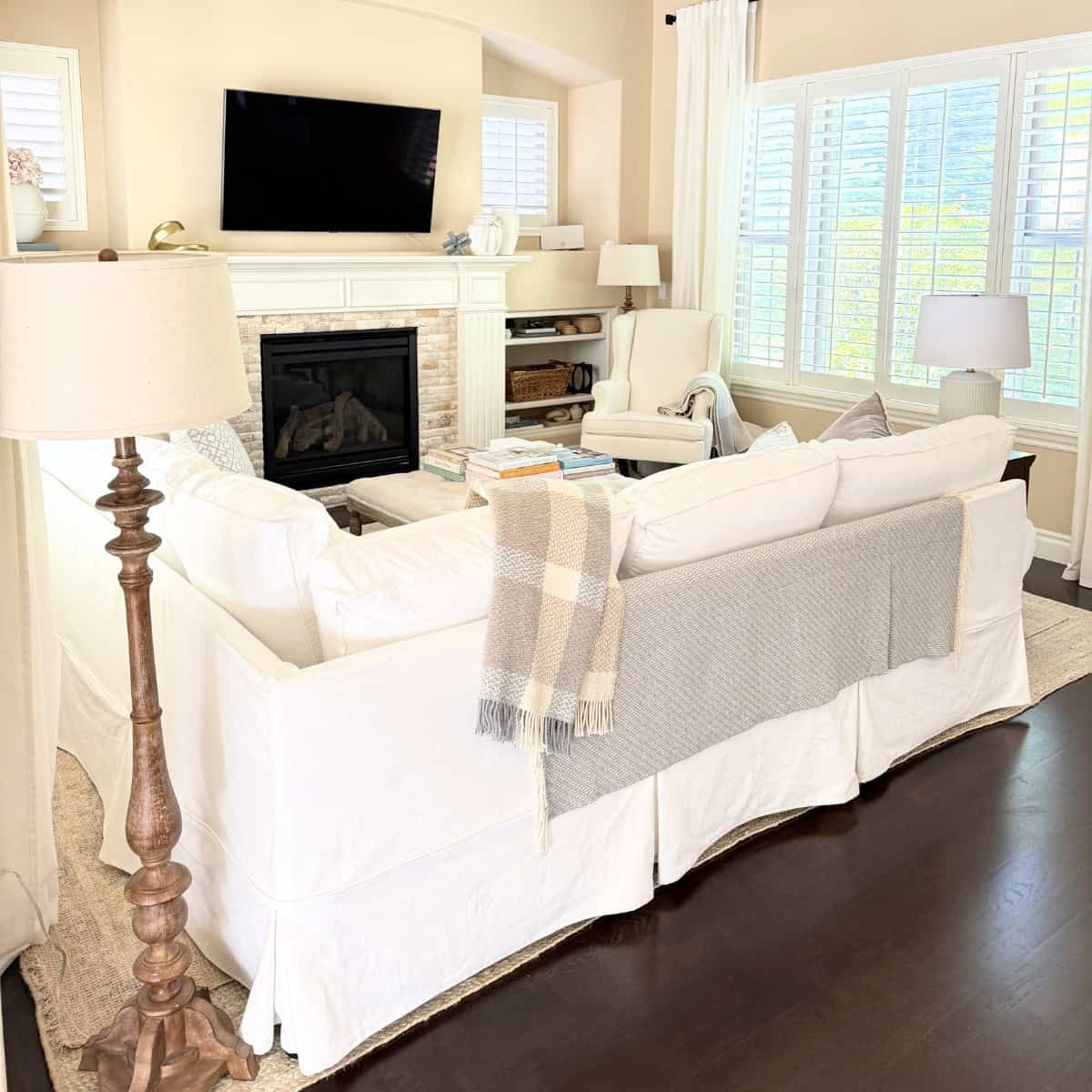 back of white slipcovered sofa in living room