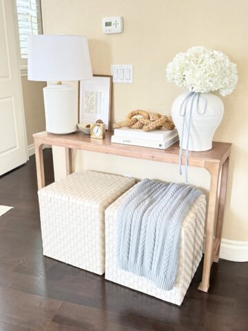 light wood entry table styled with decor