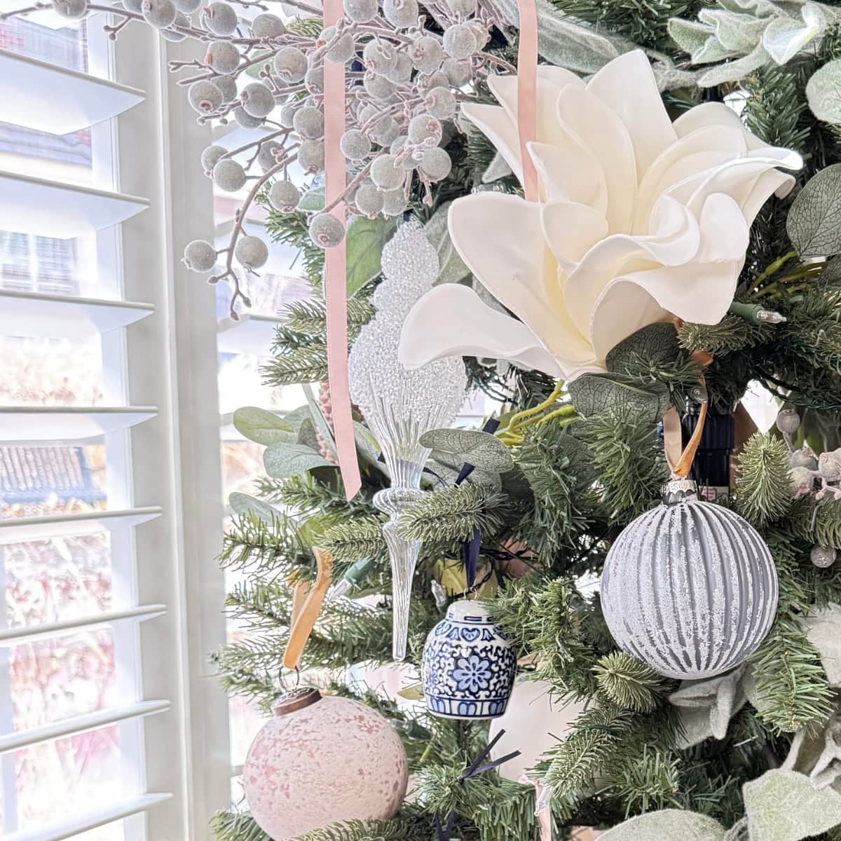 glass finial christmas ornament on tree