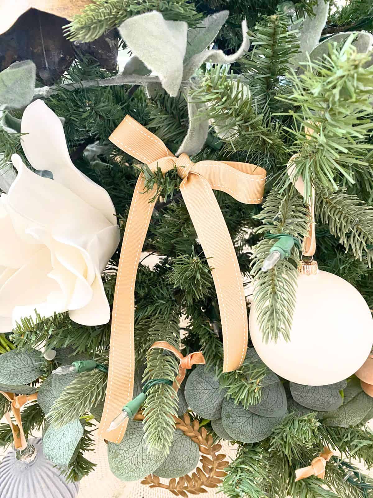 tan saddle stitch ribbon bow on tree