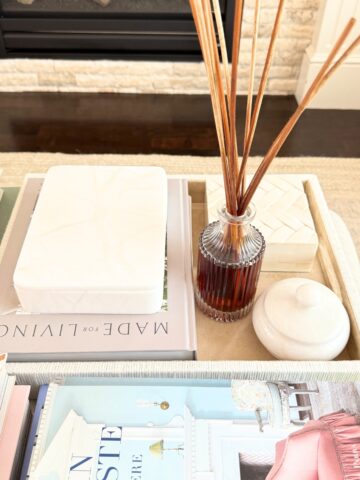 tray with decor styled on an ottoman