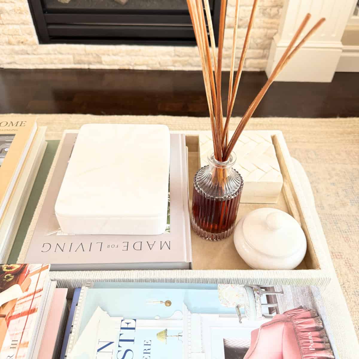 tray with decor styled on an ottoman
