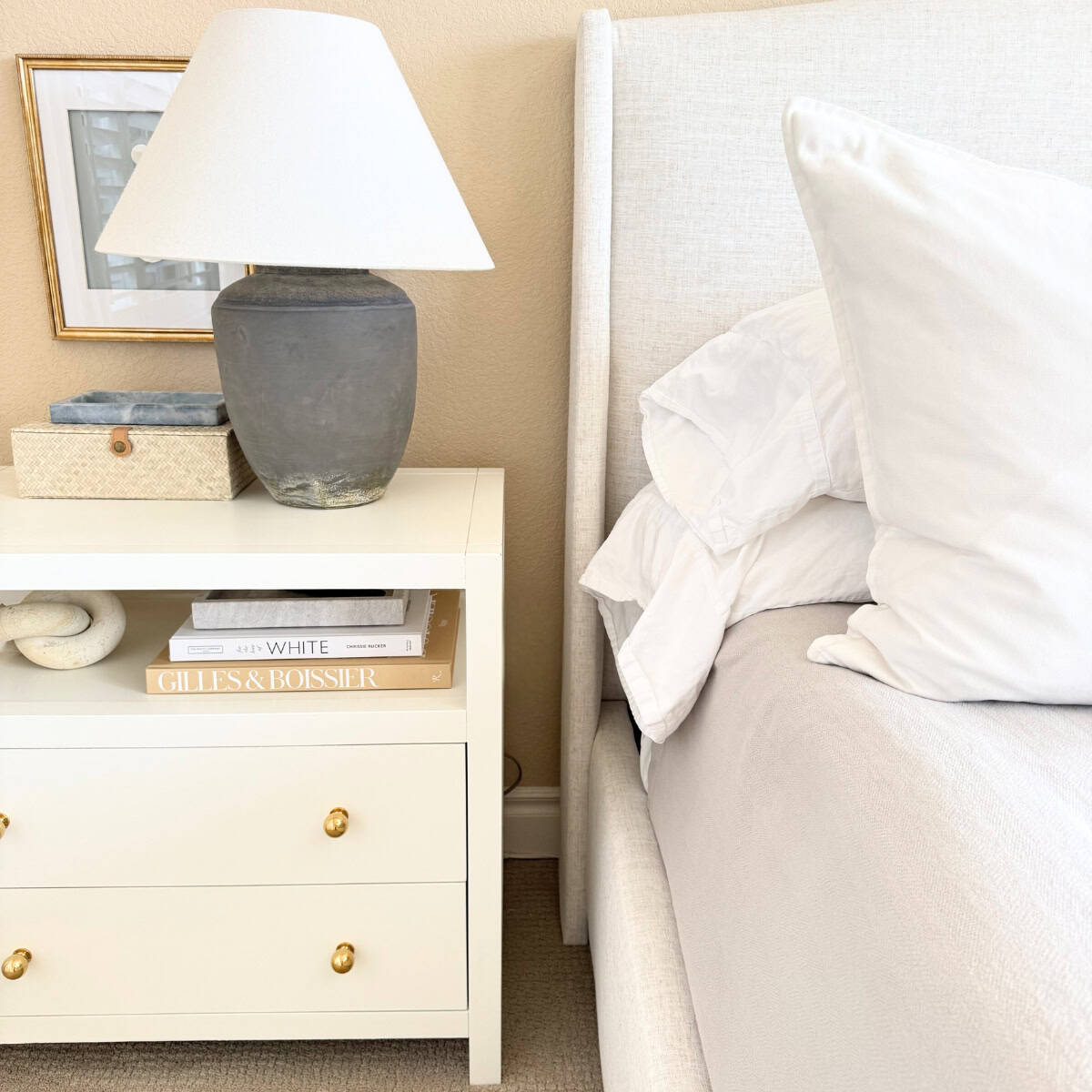 wingback upholstered bed frame with neutral fabric