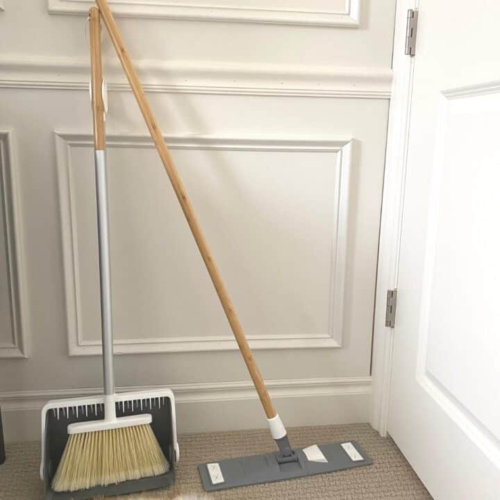 wet-dry mop and broom set against wall molding