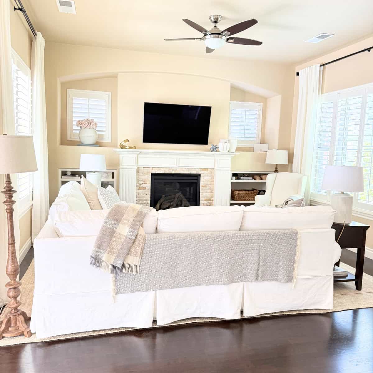 back of white slipcovered sofa in living room