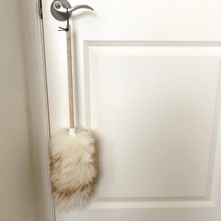 Wool duster hanging from door handle