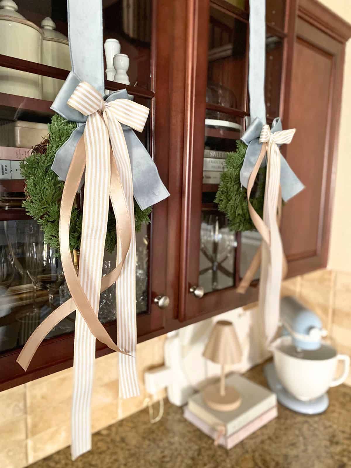 wreaths hanging on cabinets